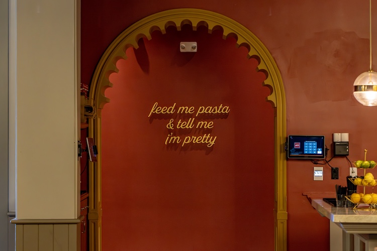 "Feed Me Pasta & tell me I'm pretty" sign inside of Jemma Hollywood