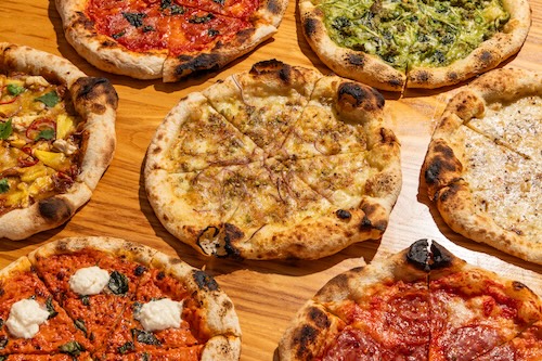 Assorted pizzas with various toppings